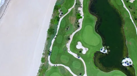 Aerial - Beautiful view of Golf Course next to ocean camera movement Stock Footage 66240722