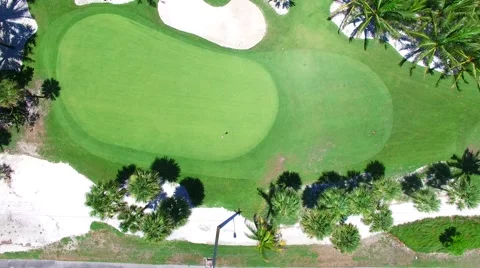 Aerial - Beautiful view of Golf Course next to ocean looking down on field Stock Footage 66240746