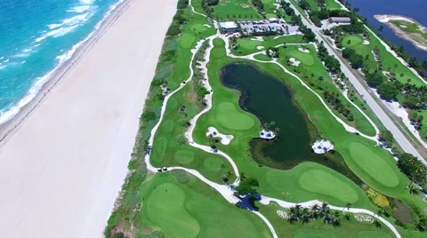 Aerial - Beautiful view of Golf Course next to ocean pan up Stock Footage 66240750