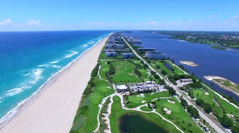 Aerial - Beautiful view of Golf Course next to ocean pan down Stock Footage 66240784