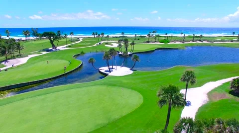 Aerial - Beautiful view of Golf Course next to ocean with movement Stock Footage 66240801
