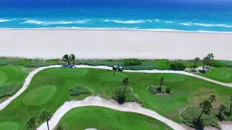 Aerial - Beautiful view of Golf Course next to ocean next to shore. Stock Footage 66240856