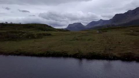 Aerial Beautiful View Of Mountain Range Under Clouds, Drone Flying Forward Over Stock Footage 233998420
