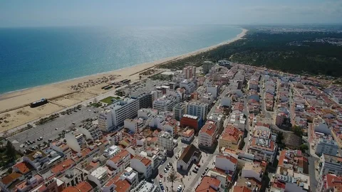 Aerial. Beautiful view from the sky of the beach and the village of Monte Gordo Stock Footage 100609549