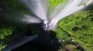 Aerial Of Beautiful Waterfall And Rainbow Falling From Green Mountain Stock Footage