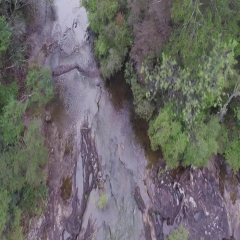Aerial of beautiful waterfall falling from cliff in Australia Stock Footage 69492995