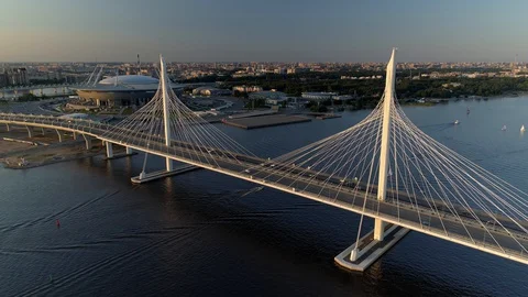 Aerial between pylons cable-stayed bridge Petersburg sunset cityscape Highway  Video stock 128749362