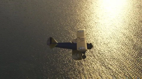Aerial Bi-plane Sunset Fly Under Video stock 5945372