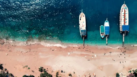 Aerial bird eye for beach blue turquoise water with three boats in summer Stock Footage