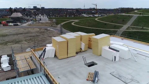 Aerial bird eye view of construction site top of roofing flying backwards 4k Stock Footage 74895776