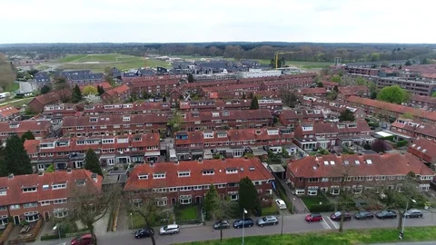 Aerial bird view flight backwards over suburbs showing family homes 4k Stock Footage 74932657