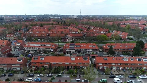 Aerial bird view flight over suburbs showing family homes 4k Stock Footage 74933043
