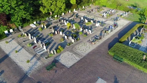 Aerial bird view flying backwards over graveyard 4k Stock Footage 79970654