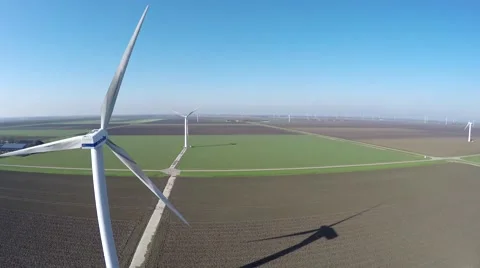 Aerial bird view moving back wind turbine windmill renewable energy 4k Stock Footage 60852937