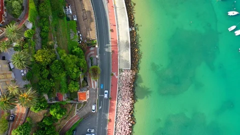 Aerial bird view moving towards Trapani marina showing several sailing boats in Stock Footage 128767096