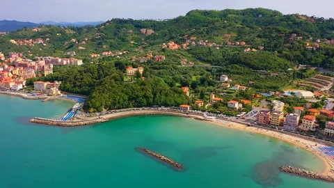 Aerial bird view moving towards Trapani marina showing several sailing boats in Stock Footage 128767321