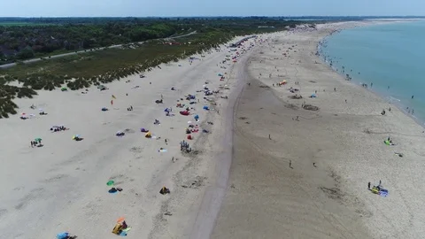 Aerial bird view over crowded beach during summer season forward flight 4k Video stock 76315875