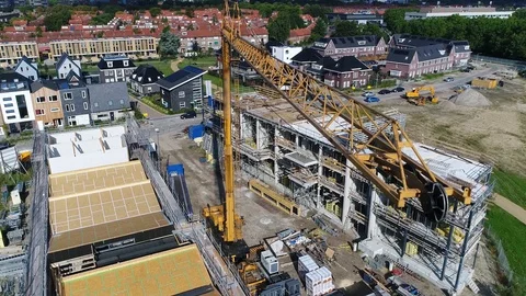 Aerial bird view of property development building site close up of tower crane Stock Footage 121440315