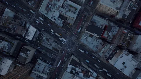 Aerial birds eye overhead top down rotating view of traffic in streets of city Stock Footage