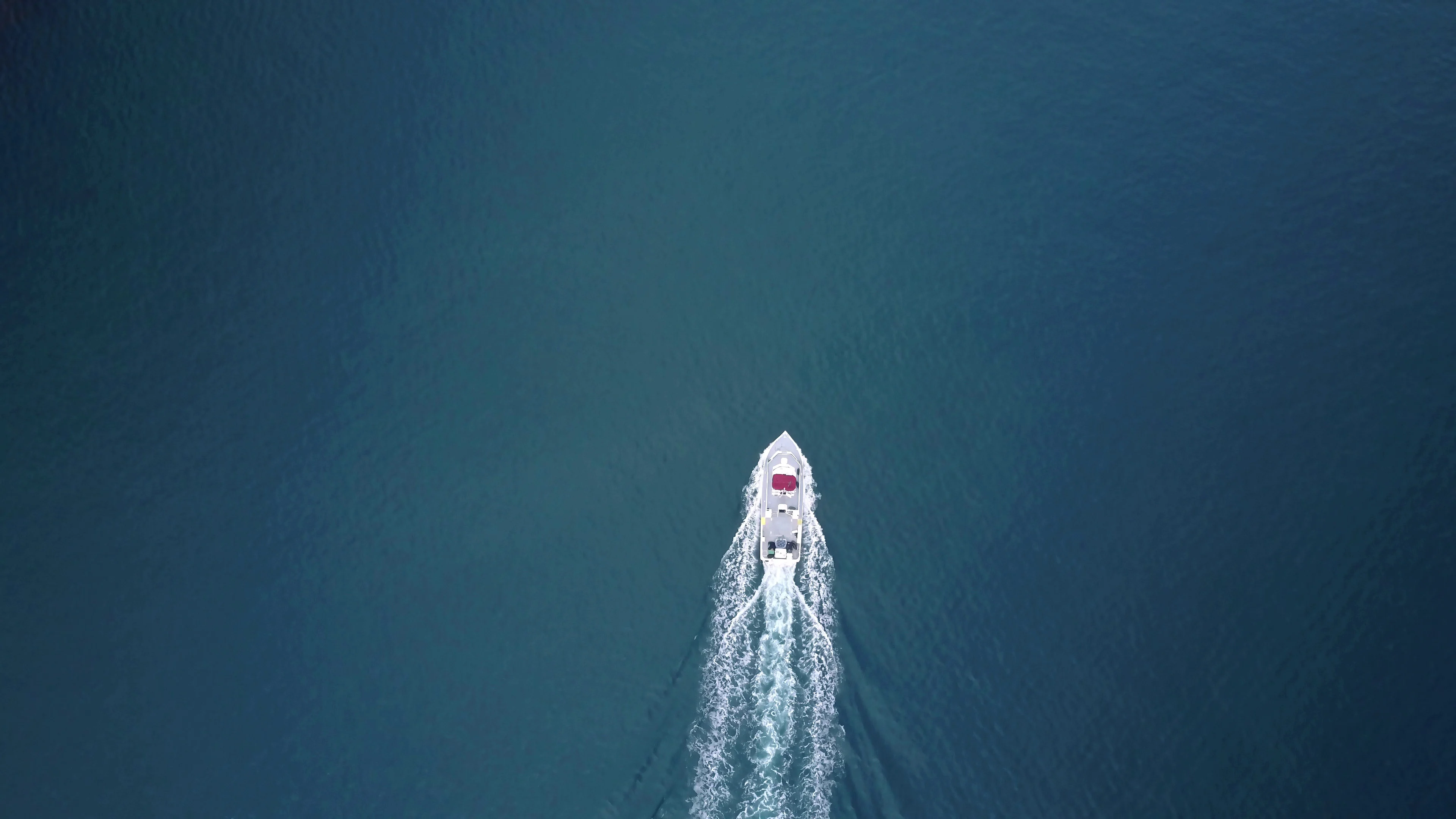 Aerial Birds Eye View Of A Ferry Boat Traveling In The Blue