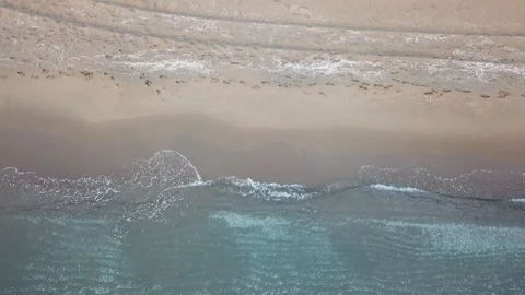 Aerial birds eye view looking down at sea waves crashing down. Stock Footage 112088550