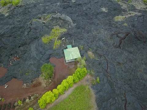 Aerial Black destructive lava flow memorial building Hawaii 4K Stock Footage 81160119