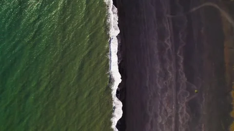 Aerial Black Sand Beach Looking Straight Down Fly Straight Over Ocean Waves Stock Footage 256698537
