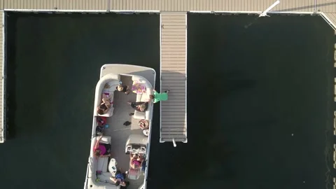 Aerial of Boat Pulling Into Harbor Dock Stock Footage 145375930