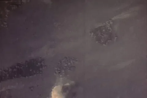 Aerial of bombs exploding on enemy land after being dropped from B-29 - 1945 Vídeos de archivo 100286321