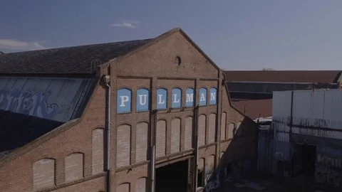 Aerial Boom down of Old Decaying Pullman Yards building. Stock Footage 82448147