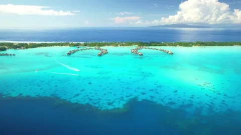 Aerial Bora Bora drone view of overwater bungalow villas in lagoon, Tahiti 4k Stock Footage 252235464