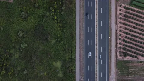 Aerial bottom view vertical highway next to virgin foresty next to virgin for Stock-Footage 159748830