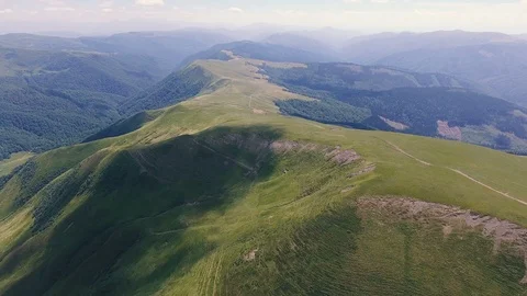 Aerial of a boundless Carpathian range with dark cloud shades in summer Stock Footage 93846057