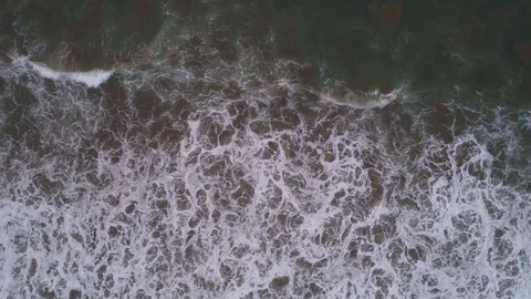 Aerial of breakers at a beach after the sunset. Pacific Ocean Stock Footage 102630891