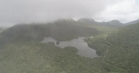 Aerial breaks through the clouds to reveal the Fresh Water Lake in Dominica Stock-Footage 78446909