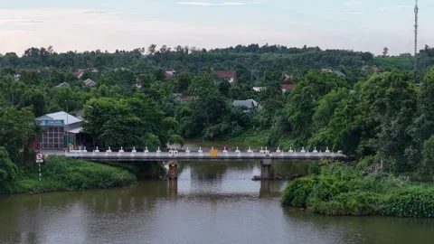 Aerial of bridge and temple over Perfume River at Hue 4K Stock Footage 339863219