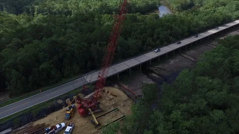 Aerial of bridge construction with large boom crane 4K Stock Footage 110923957