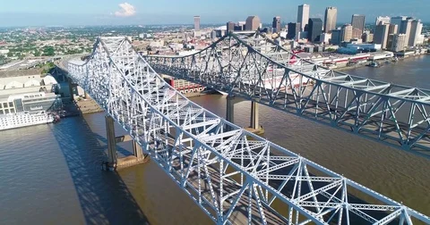 Aerial of bridge passing over river and beautiful cityscape Video stock 83690673