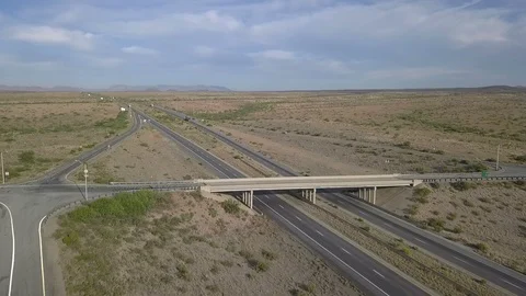 Aerial of a bridge spanning an interstate highway Stock Footage 112017188