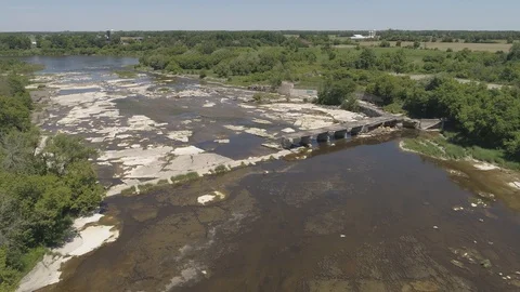 Aerial broken train bridge over river rock bed beautiful flight pattern Vídeos de archivo 102630903