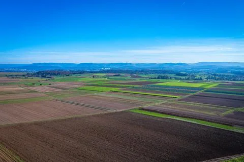 Aerial of brown empty fields and view to the swabian alb Stock Photos