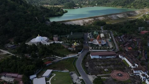 Aerial of Buddhist Temple Complex Below Turquoise Reservoir, Phuket Stock Footage 347989196