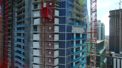 AERIAL - Building in construction elevator Stock Footage 65153975