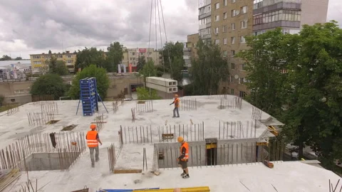 Aerial Building Process of Construction Site. Engineers crane and city. Stock Footage 113321157