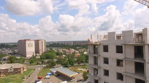 Aerial Building Process of Construction Site. Engineers crane and city. Stock Footage 113331523