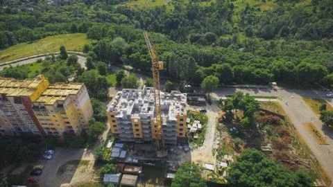 Aerial Building Process of Construction Site. Engineers crane and city. Stock Photos