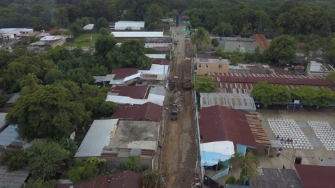 Aerial of bull dozer digging in poor Guatemalan village Stock Footage 126795758