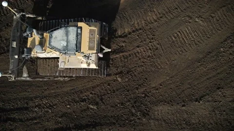 Aerial Of Bulldozer Driving Through An Active Construction Site Stock Footage 145377915