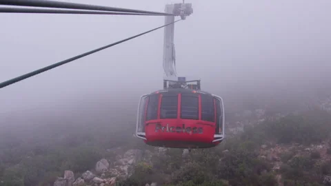 Aerial cable car approaching through thick mist Stock Footage 242015747