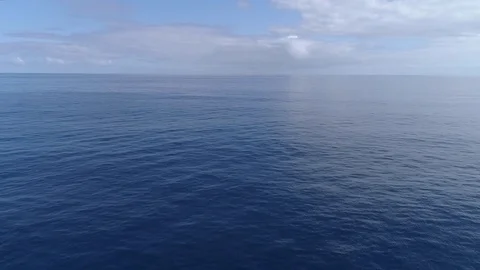 Aerial of calm ocean surface, smooth forward movement Stock Footage 83240364